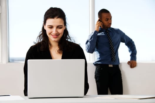 male and female business partners in a window office