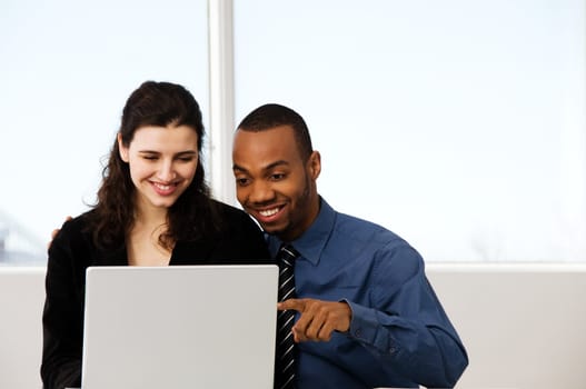 male and female business partners in a window office