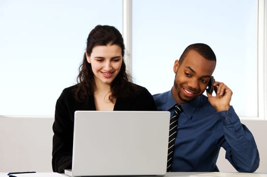 male and female business partners in a window office