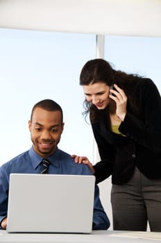 male and female business partners in a window office