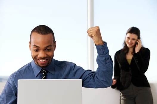 male and female business partners in a window office