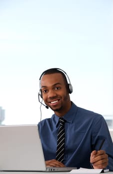 Customer Service agent in an office with laptop