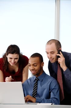 business team in an office on a laptop