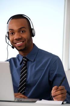 Customer Service agent in an office with laptop