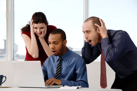 business team in an office on a laptop