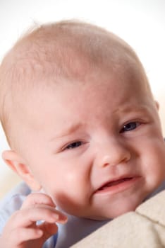 crying new born baby with blue eyes
