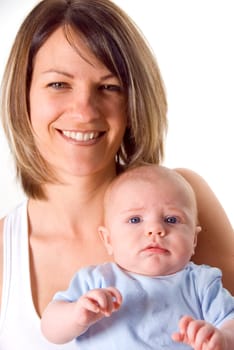 blue eyed baby with his happy mother