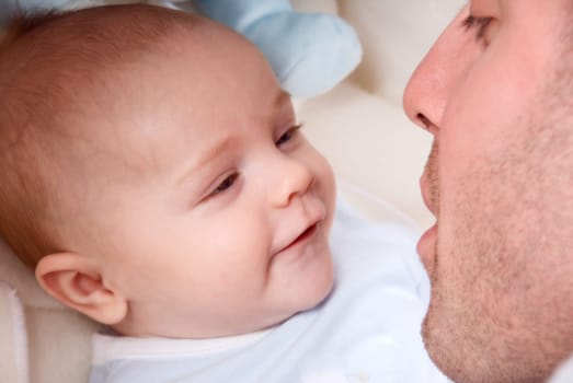 dad playing with his cute baby boy
