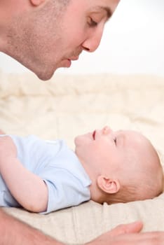 dad playing with his cute baby boy