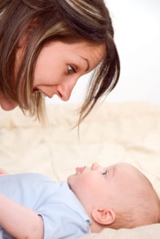 baby boy grimacing at his surprised mom