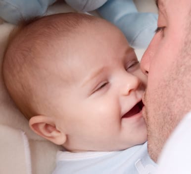 dad playing with his cute baby boy