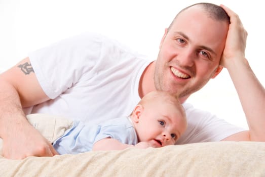 dad playing with his cute son in blue