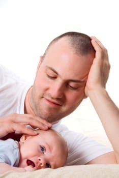 dad playing with his cute son in blue