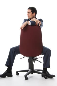 business man sitting on a chair and looking side