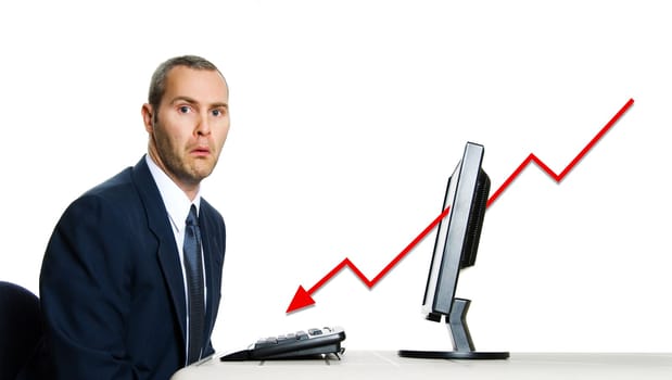 unhappy man in blue suit at office computer financial crisis