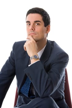 man in a blue suit on a chair thinking