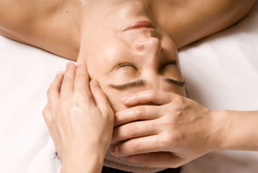 woman relaxing with a nice facial massage