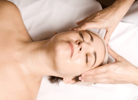 woman relaxing with a nice facial massage