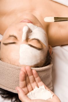 woman relaxing with a nice facial cream