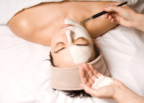 woman relaxing with a nice facial cream