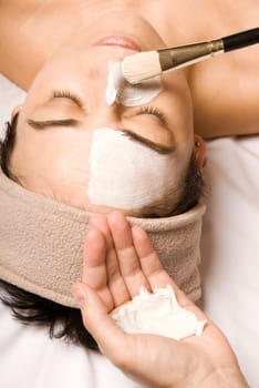 woman relaxing with a nice facial cream