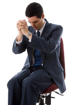 man on a chair in a blue suit doing a prayer