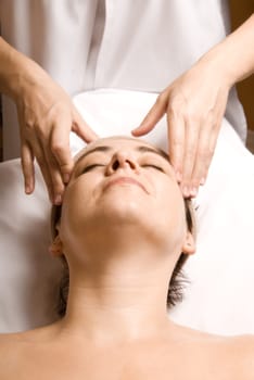 woman relaxing with a nice facial massage