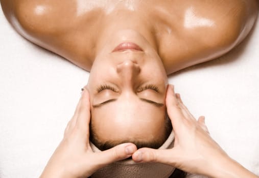 woman relaxing with a nice facial massage