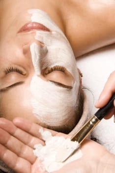 woman relaxing with a nice facial massage