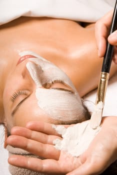 woman relaxing with a nice facial massage