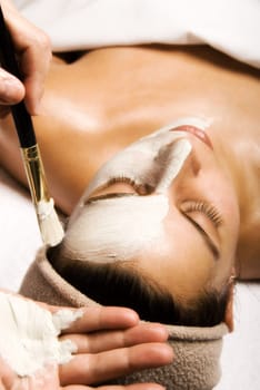 woman getting a facial at a day spa