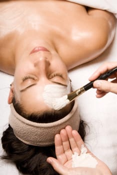 woman relaxing with a nice facial massage