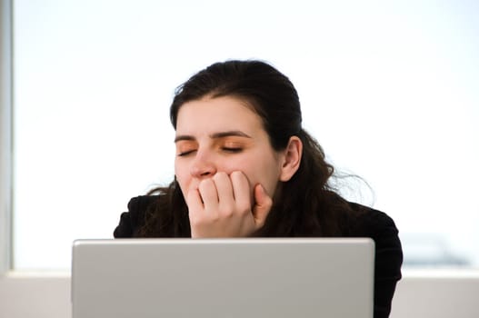 business woman sleeping on the job at work