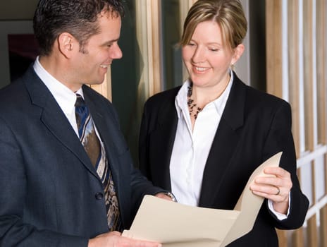 two business people looking at some files