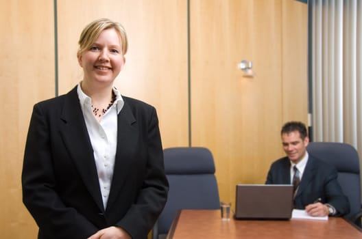2 business people with woman in foreground
