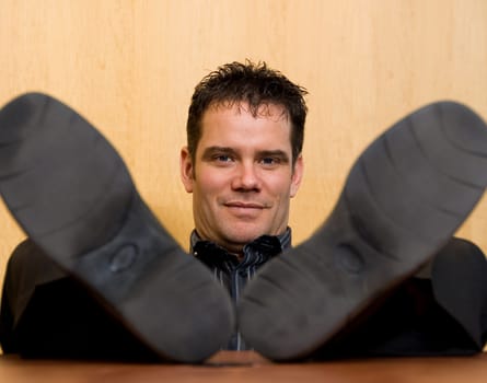 business man with his feet on the desk