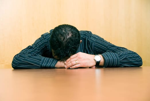 business man sleeping at his desk in the office