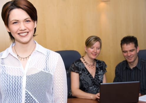 3 business colleagues in a meeting room