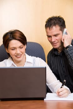 two business colleagues in a boardroom in a meeting