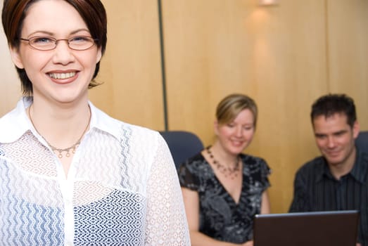 3 business colleagues in a meeting room