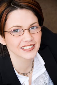 Business portrait of a cute woman looking up