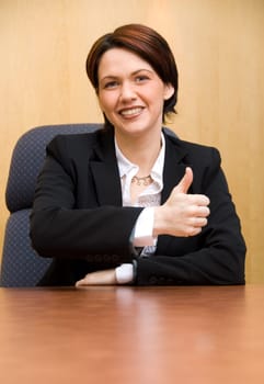 happy business woman in a boardroom table