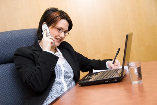 busy woman on the phone and on her laptop