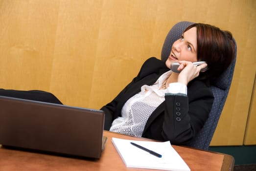cute business woman on the phone chatting