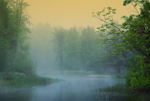 morning misty riverwith orange and blue hues
