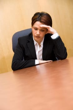 sad cute woman at the office at her desk