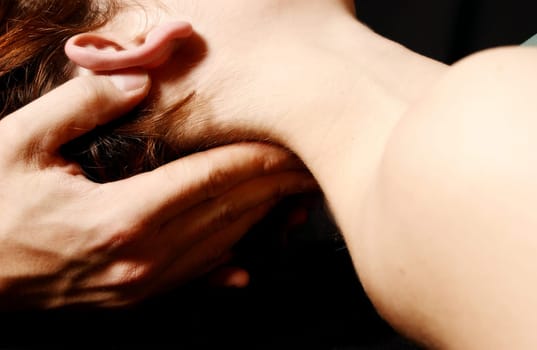 woman in a spa getting a neck massage