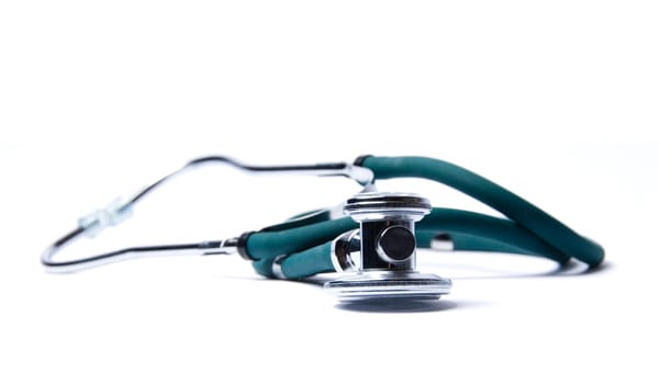 Stethoscope in green on an isolated white background