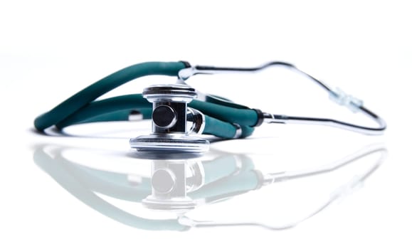 Stethoscope in green on an isolated white background