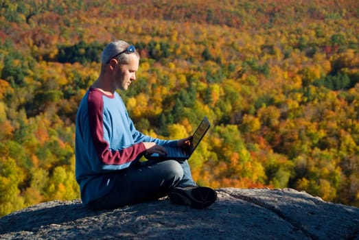 getting away from it all on the laptop in nature